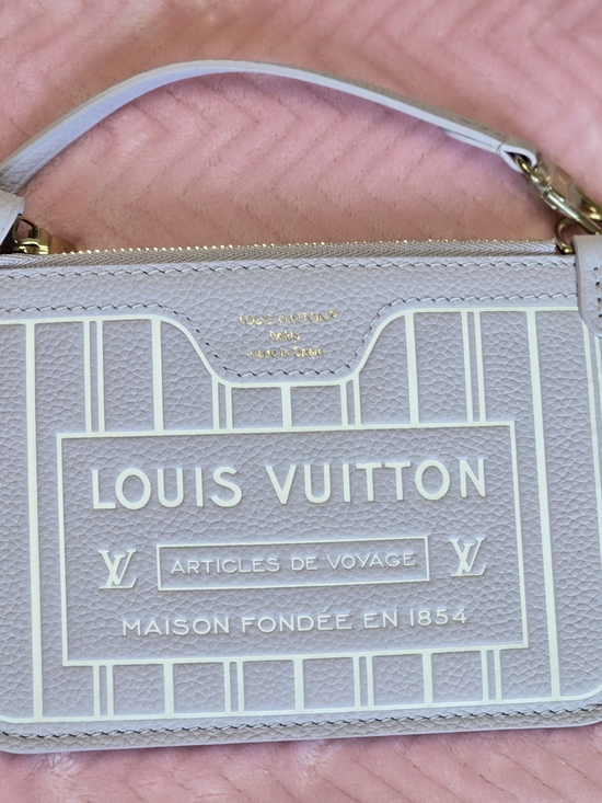 Louis Vuitton Handbags - Louis Vuitton Pale Pink Leather Logo Wristlet with Cream Trim